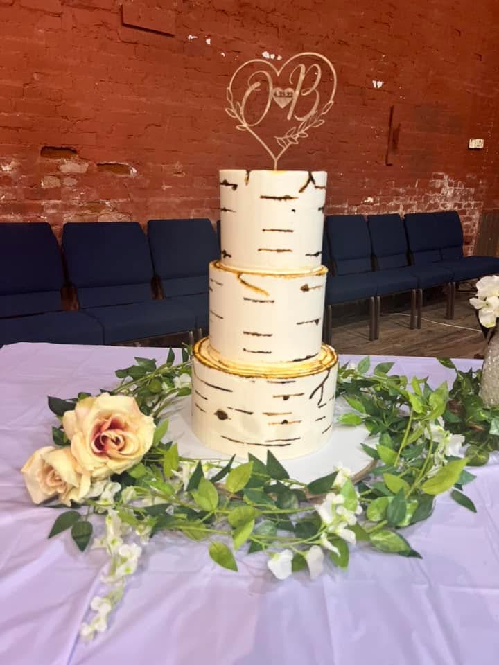 Rustic birch wedding cake with flowers