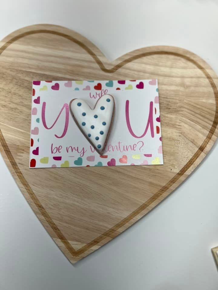 White polka dot heart cookie on a Valentine card